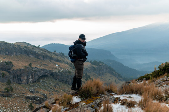 Hiker backpacking in mexico iztaccihuatl volcano winter landscape - Powered by Adobe