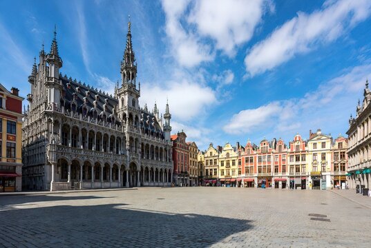 Grand Leuven Town Hall and colorful historic buildings on a sunny city