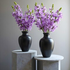 Studio shot of two black vases with flowers, on podiums.