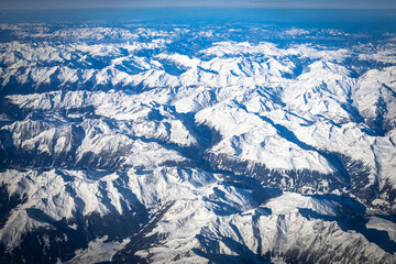 Obraz premium aerial view over european alps in winter, view from plane, mountains, snow, ice, winter, austrian alps
