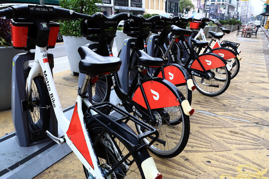Los Angeles California &ndash; November 4, 2025: Metro Bike bicycles with DoorDash advertising at a public bike sharing station