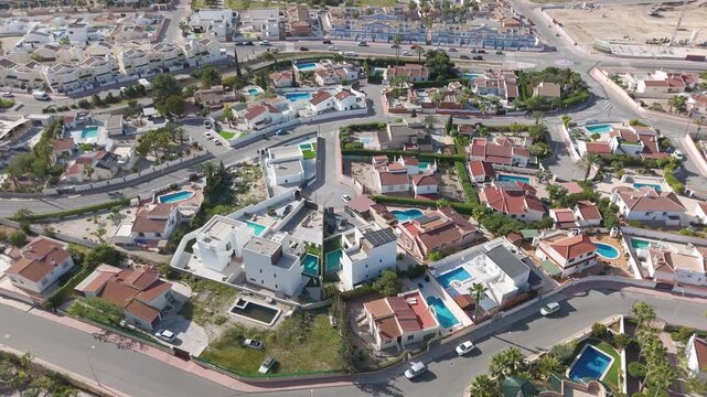 Aerial view of residential area with villas and swimming pools in Quesada Spain