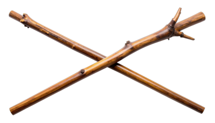 Two polished wooden sticks crossed in an 'X' shape against a black background.