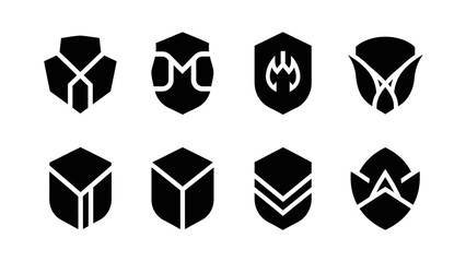 Set of eight abstract black shield emblems for design elements