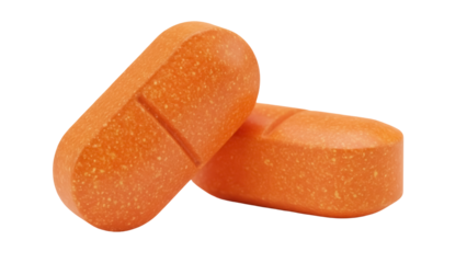 Two orange multivitamin tablets isolated PNG, nutritional supplement for health and wellness on transparent background