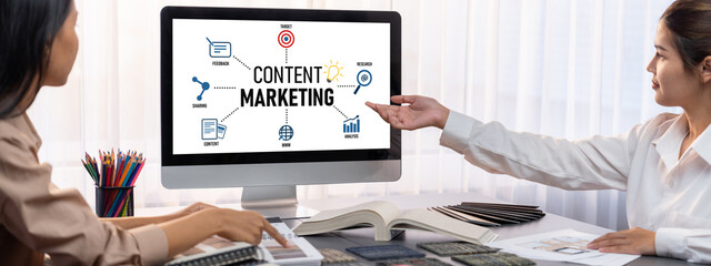 Group of interior architect designer team at table choosing various mood board samples with architecture software on laptop screen. Modern renovation and interior material selection concept. Insight