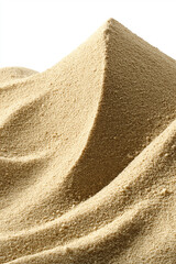 Sandy dune-like structures of fine golden brown sugar in close-up