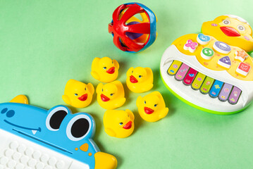 Colorful toys on a green background