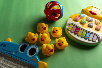 Colorful toys on a green background