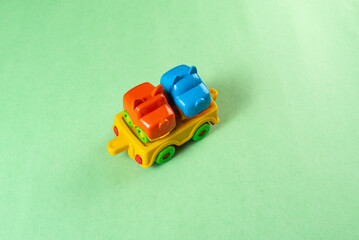 Colorful toys on a green background