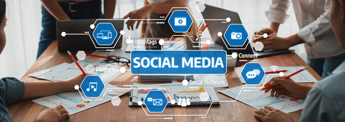 A dynamic workspace showing teamwork in planning social media strategies, incorporating digital tools and collaborative efforts for impactful marketing and communication. Amity