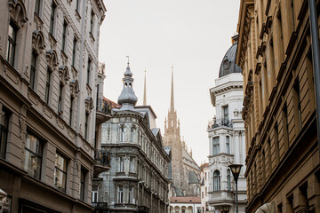 Fototapeta premium Historic street in Brno with Gothic cathedral spires, Czech Republic