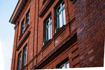 Sunlit Photograph Of Aged Brick Facade, Closeup Shot Highlighting Weathered Brick And Ornamental Features