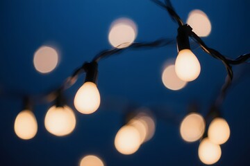 String of lights illuminates in the darkness with a warm glow