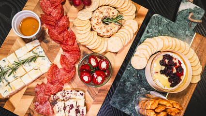 Beautiful charcuterie board featuring assorted cheeses, cream cheese stuffed peppers, salami, crackers, honey, grapes, and cheese spread. Perfect for sharing, entertaining, and elegant gatherings. Vis