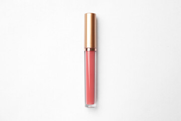 Beautiful pink lip gloss on white background, top view