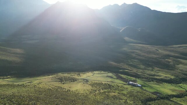 A flyover of the moorland near a farm overlooking the Nevado de Tolima volcano in Colombia