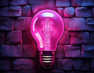 a glowing pink lightbulb symbol shines brightly against a rough dark stone wall the image symbolizes inspiration creativity and innovation