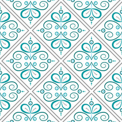 Fototapeta premium Seamless pattern in vintage stale. Complex ornament of curved lines and curls. Blue filigree elements on white background. Mosaic tile decor