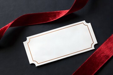Blank elegant ticket with red velvet ribbon on dark background symbolizing invitation, celebration and premium design. Minimal luxury image perfect for events, branding, gift cards and exclusive annou