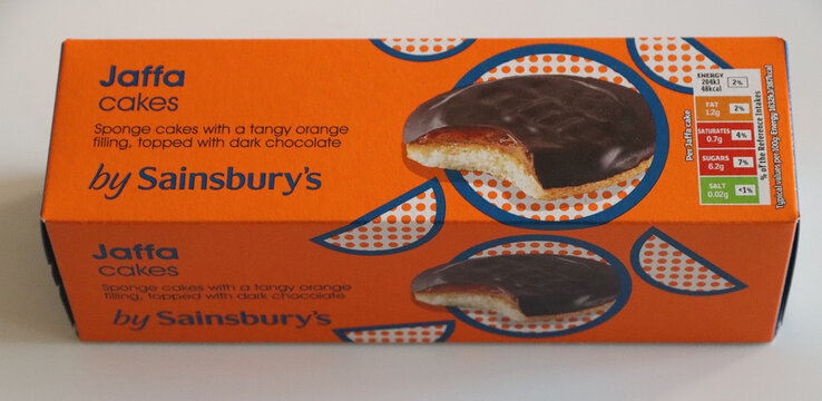 Norwich, england november 26 2025 orange box of jaffa cakes by sainsburys on white background isolated on white background