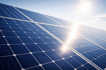 Solar panel close up with sun flare shining brightly, capturing clean energy technology under clear blue sky, symbolizing sustainable power and environmental innovation