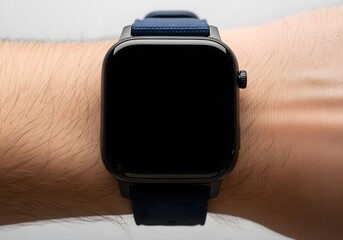 Close up of a person's wrist wearing a sleek black smart watch with a navy blue sport band.