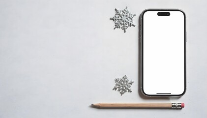 Flat lay mockup of a smartphone with a blank white screen, pencil, and silver snowflake ornaments on a light gray background.