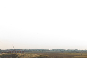 empty jetways and glass terminal facade facing quiet apron, contemporary architecture with boarding bridges and lamp poles,