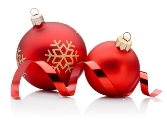 Two red Christmas decoration baubles and curling paper ribbon isolated on white background