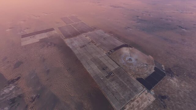 Top aerial drone view of CT MSR Tower at Solar Park in Dubai. United Arab Emirates