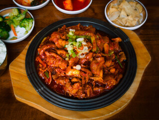 Fototapeta premium Korean jeyukkui, spicy pork stir‑fry served on a hot metal plate