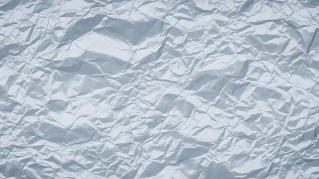 Crumpled white paper texture viewed from above in a detailed close-up