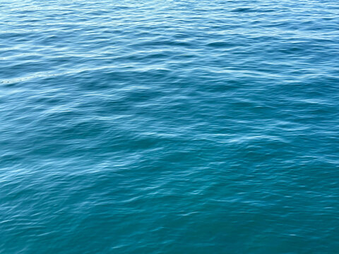 Water blue calm ripple surface background.