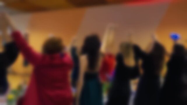 Participants signal questions and respond openly during panel discussion at conference venue