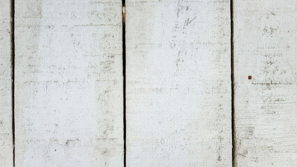 Rustic white painted wooden planks texture with visible grain and gaps. Shabby chic timber background