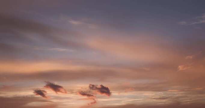 Beautiful sunset with different colors and clouds as the sun sets over the horizon, multi-colored sky with warm colors and a touch of sunset or sunrise