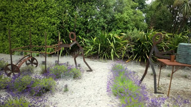 Whimsical Metal Stick Figure Sculptures At Farm Garden Display