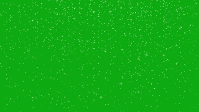 Isolated falling down christmas snow animation on green screen background. Snowflakes bokeh- Falling swirling realistic winter snow motion. Snow flakes slowly falling densely against green screen.