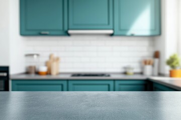 Empty concrete kitchen countertop offering ample copy space with blurred modern teal cabinetry and white subway tile background