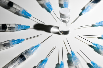 Single Use Syringes with Needles on White Background