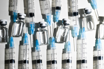 Single Use Syringes with Needles on White Background