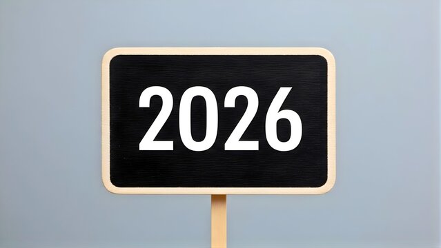 Chalkboard sign displaying the year 2026 in white numbers, symbolizing future planning, upcoming events, and new beginnings against a simple grey background - Powered by Adobe