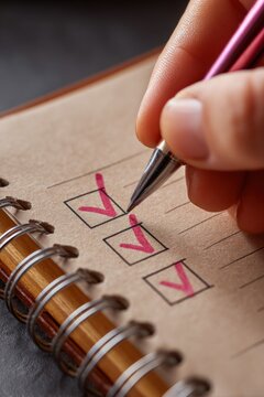 Hand checking list with pen