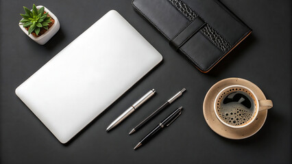 Top view of business essentials laptop, coffee, pens, and succulent on dark desk