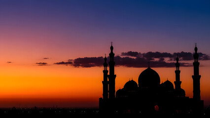 Obraz premium Silhouette of Grand Mosque at Sunset with Colorful Evening Sky