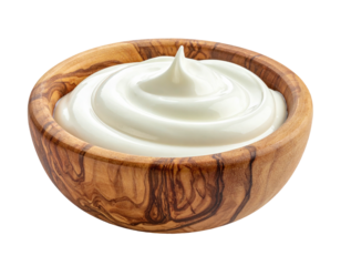 Creamy, white swirl in a wooden bowl, isolated on black