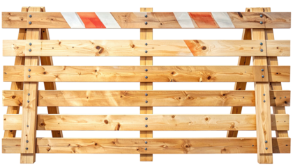 Wooden barrier with orange and white stripes for roadwork, against black