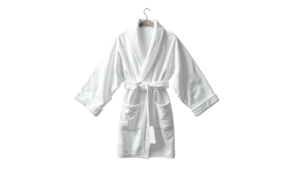 White, fluffy bathrobe hanging, front view, isolated on a black background