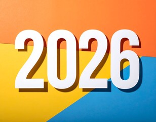 Bold white numbers "2026" on overlapping orange, yellow, and blue paper
